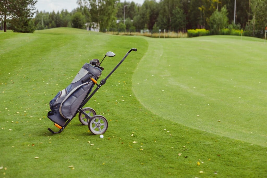 Can I get relief if a trolley moves my ball? – National Club Golfer | National Club Golfer A golf trolley close to a green | Source: Adobe Stock
can I get relief if a trolley moves my ball