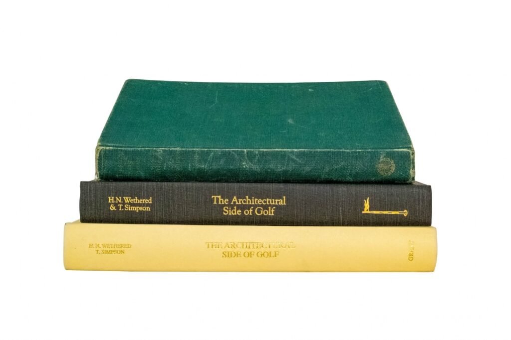 Building a golf course architecture library doesn't need to be expensive. A photo of three books. 2 reprints and the 1952 book Design for Golf are shown as examples.